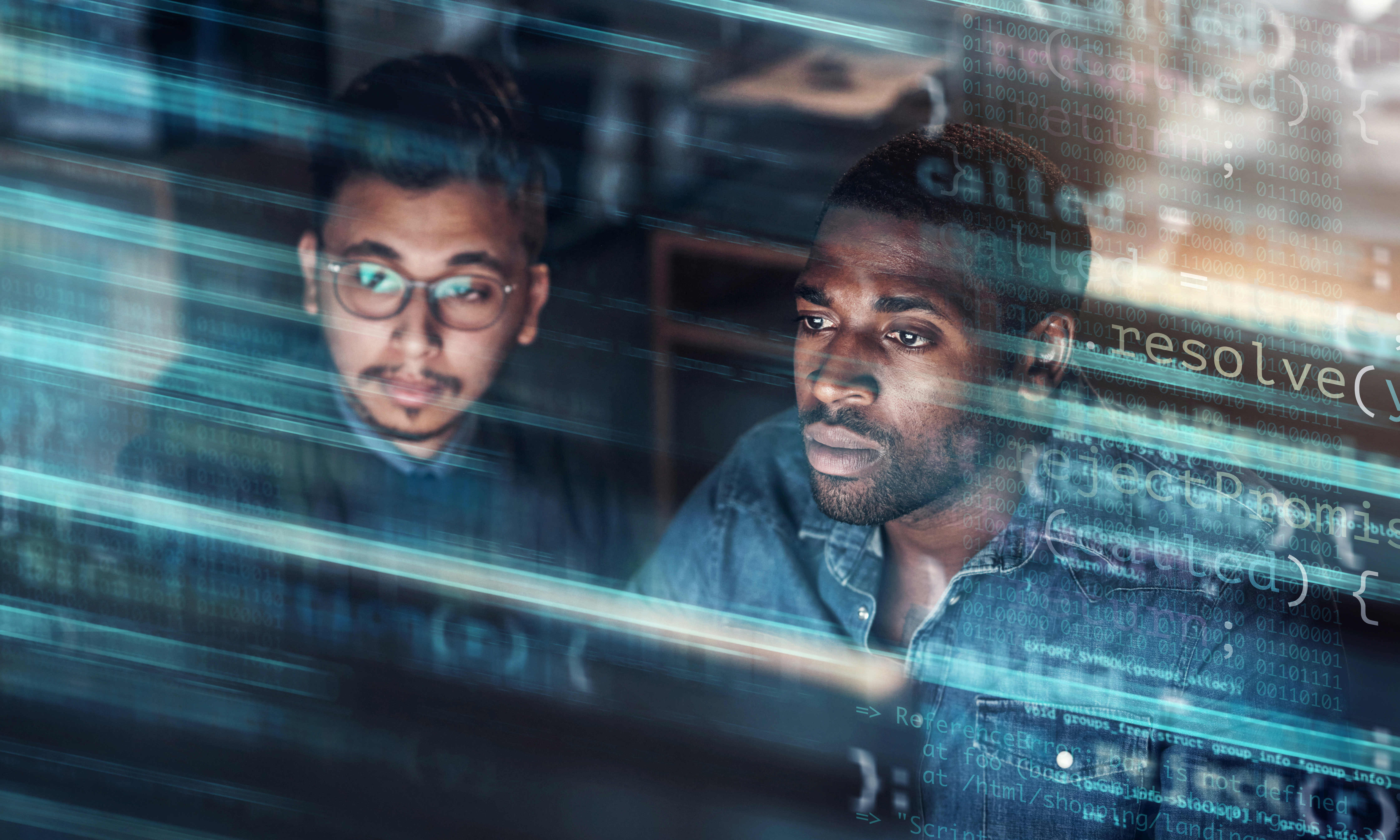 two men concentrating hard on a data display