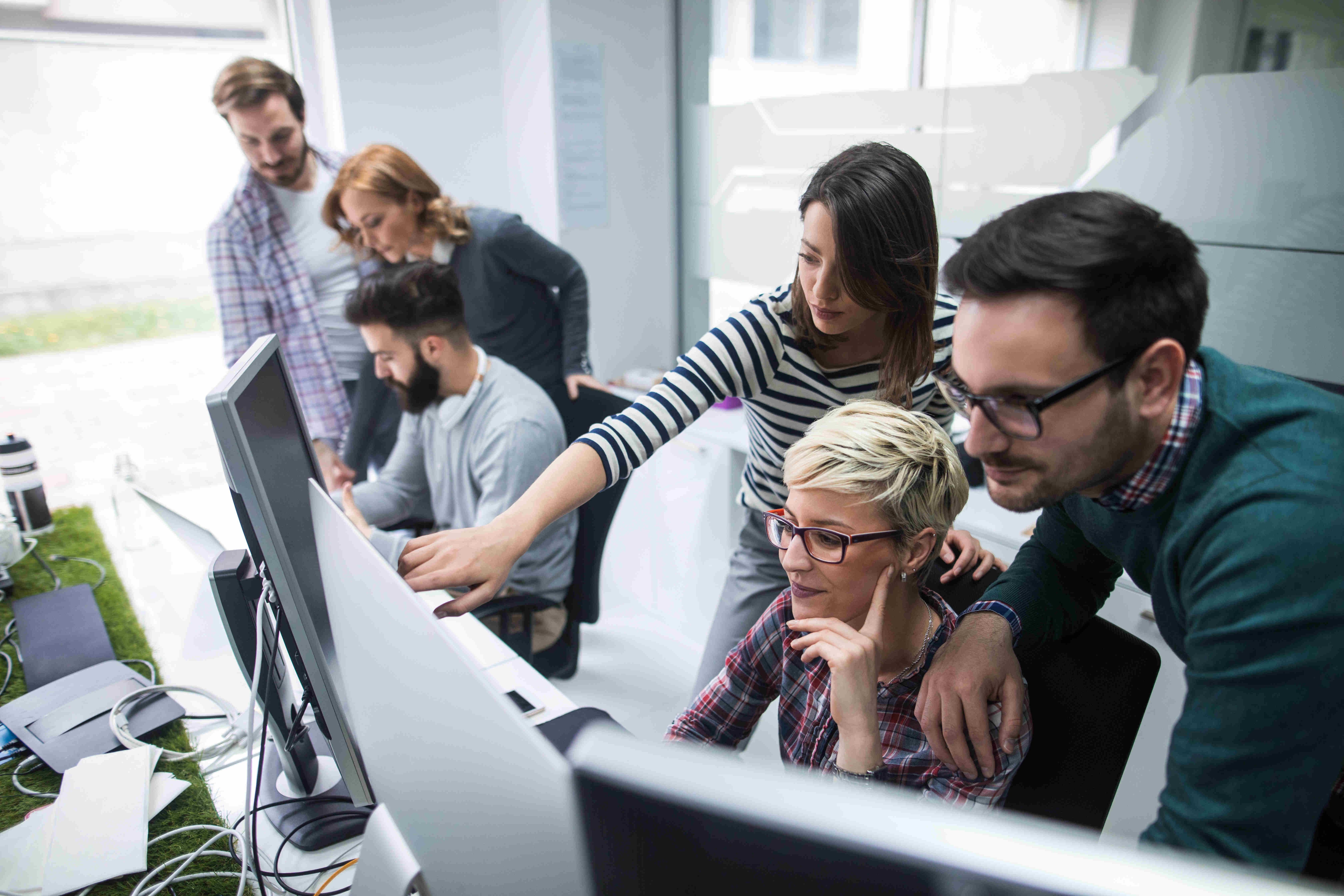 Group of enthusiastic coders digging into a challenge 